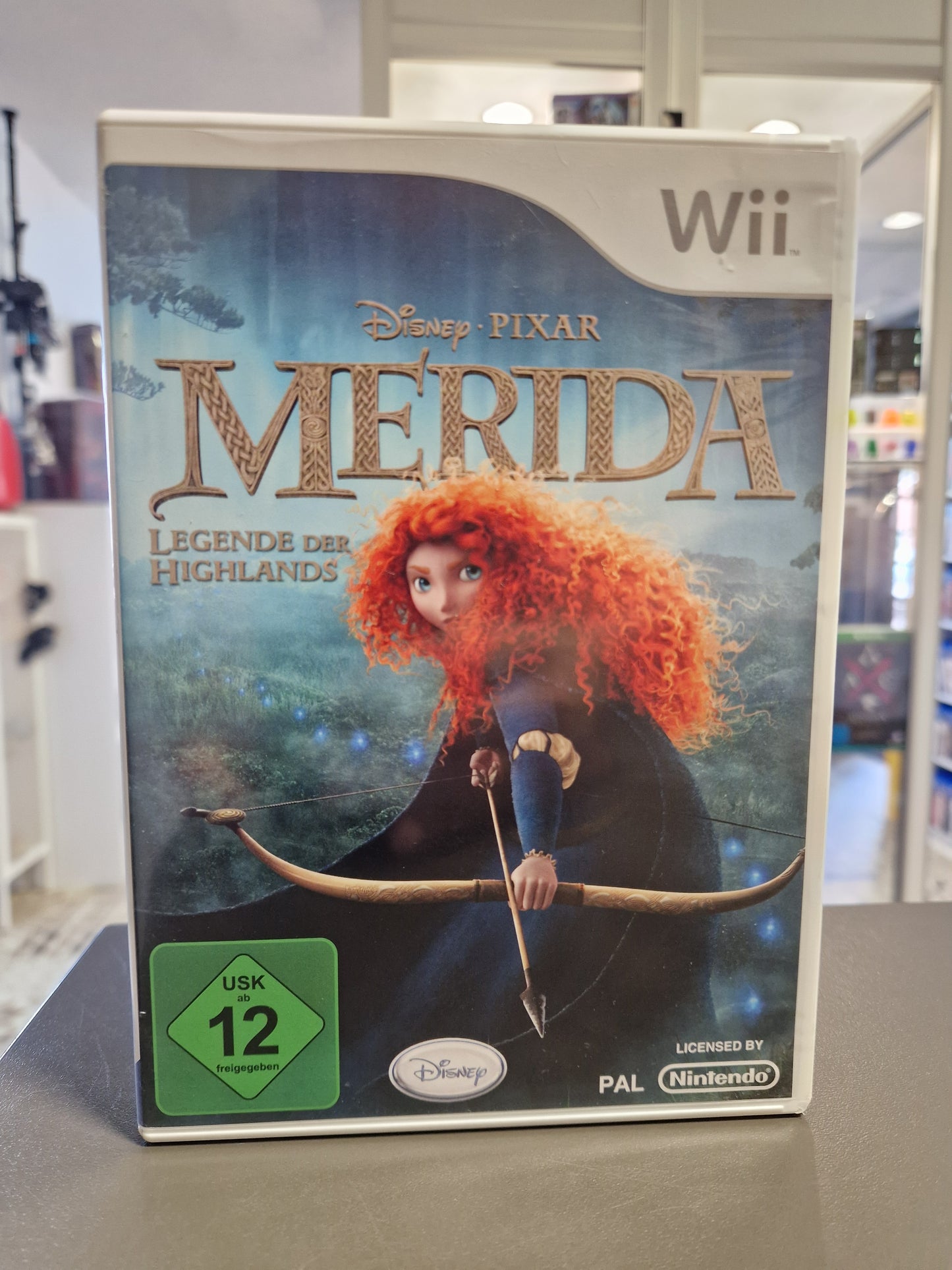 Vorderseite der Nintendo Wii Hülle von Disney Pixar Merida Legende der Highlands mit USK 12 Logo.