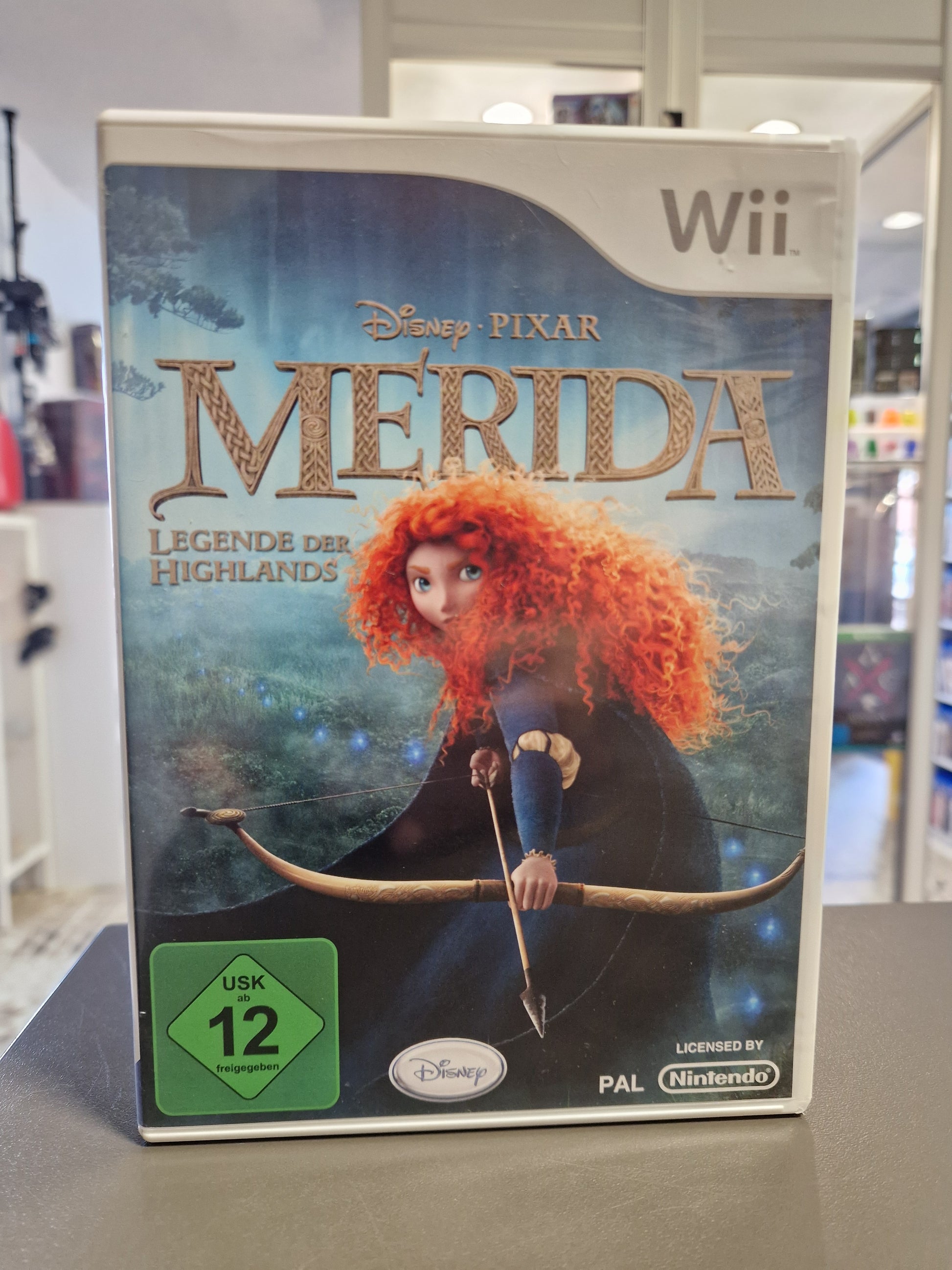 Vorderseite der Nintendo Wii Hülle von Disney Pixar Merida Legende der Highlands mit USK 12 Logo.