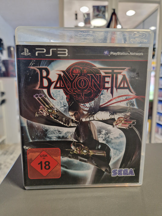 Vorderseite der PlayStation 3 Hülle von Bayonetta mit der Hexe im Mondschein, Pistolen in den Händen und rot-weißem USK 18 Logo.