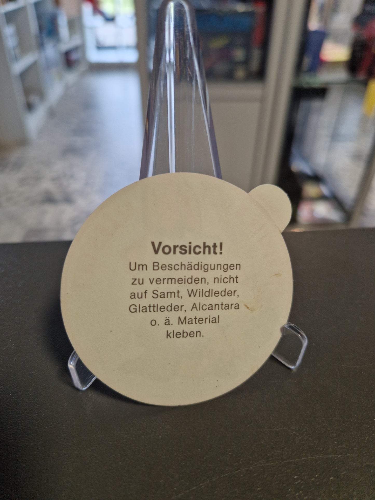 Ruckseite des unbenutzten runden Kelloggs Smacks Textil Stickers aus dem Jahr 1983 mit Warnhinweis