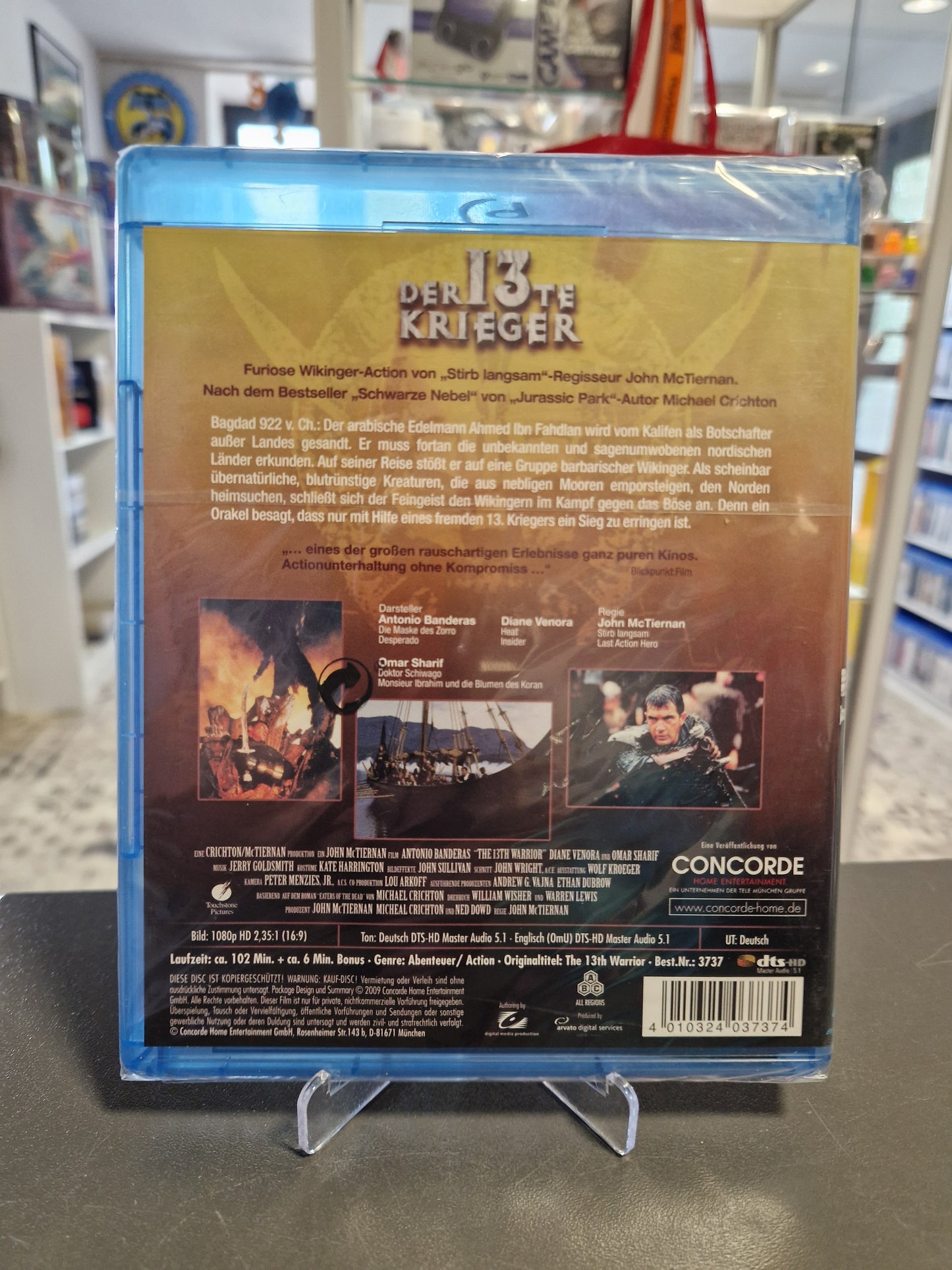 Rückseite der Blu-ray Der 13te Krieger. Enthält die Inhaltsangabe, Besetzungsliste und technische Daten (Tonformate, Laufzeit). Sichtbar ist die Concorde Home Entertainment Veröffentlichung.