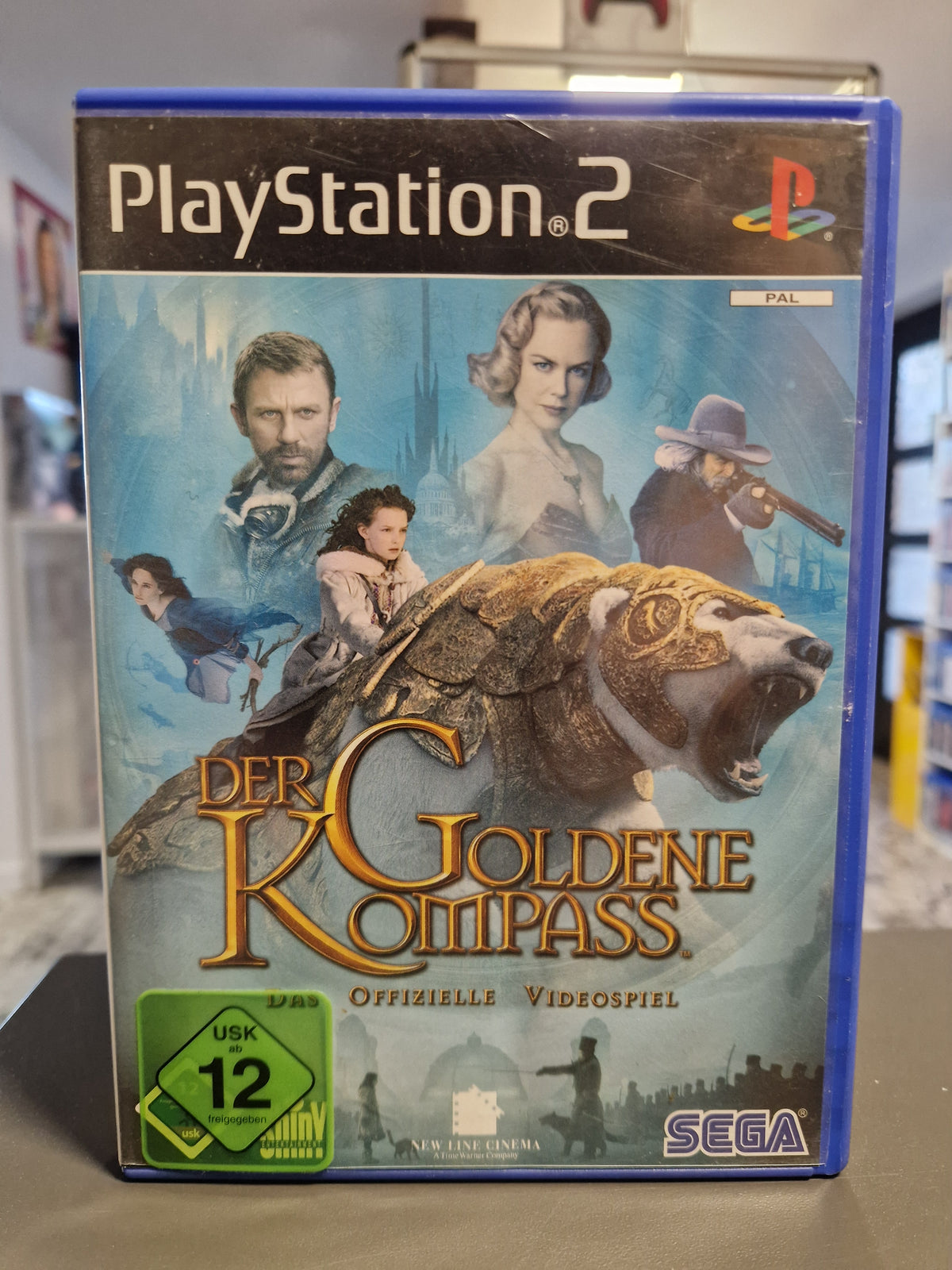 Vorderseite der PS2 Hülle von Der Goldene Kompass Das offizielle Videospiel.