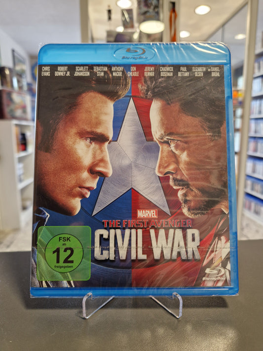 Blu-ray Cover von Marvels „The First Avenger: Civil War“ mit FSK 12 Logo. Zu sehen sind Captain America und Iron Man im Profil, die sich gegenüberstehen.