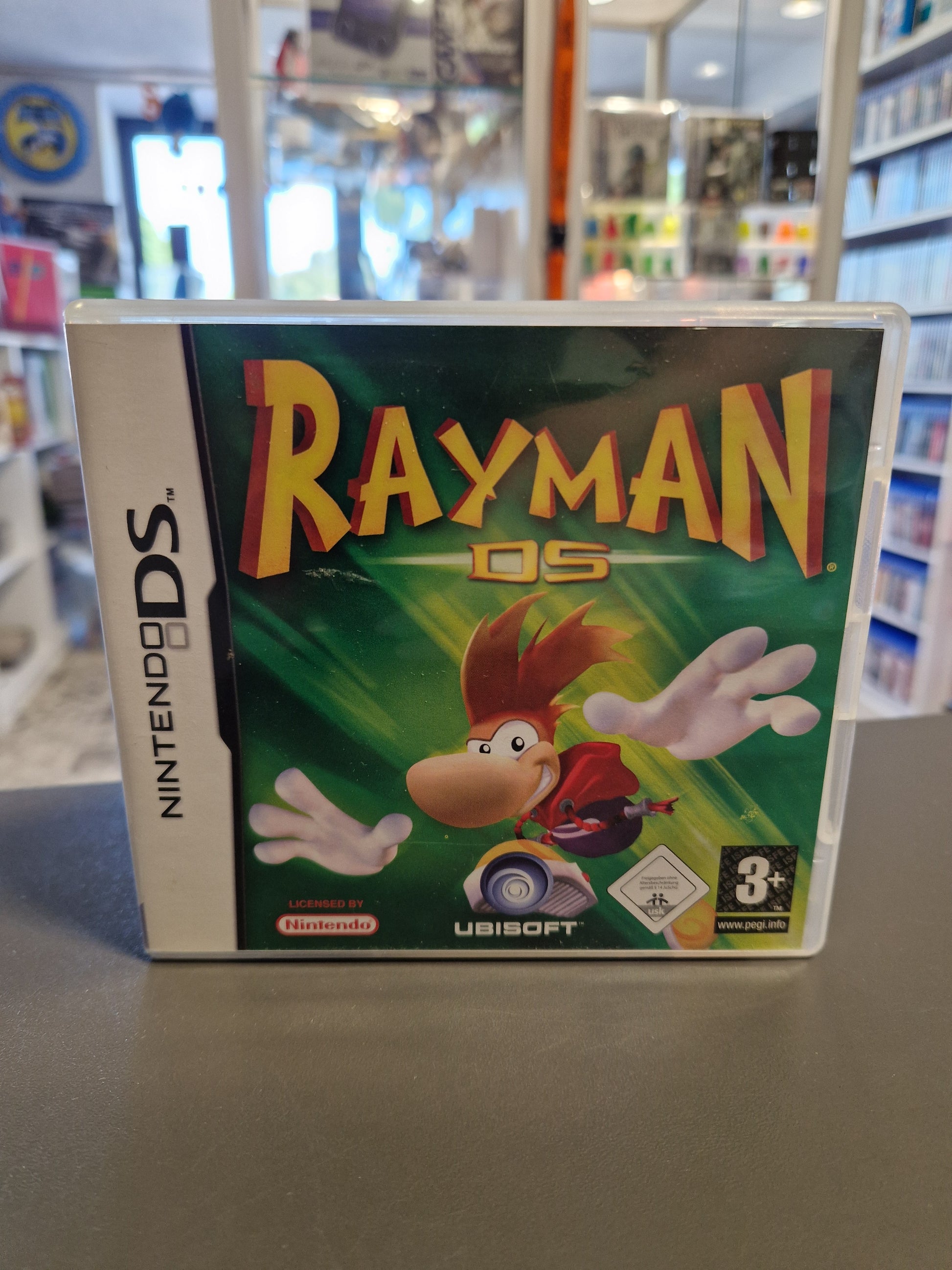 Vorderseite der Nintendo DS Hülle von Rayman DS mit Ubisoft-Logo und PEGI 3+ / USK Freigabe.