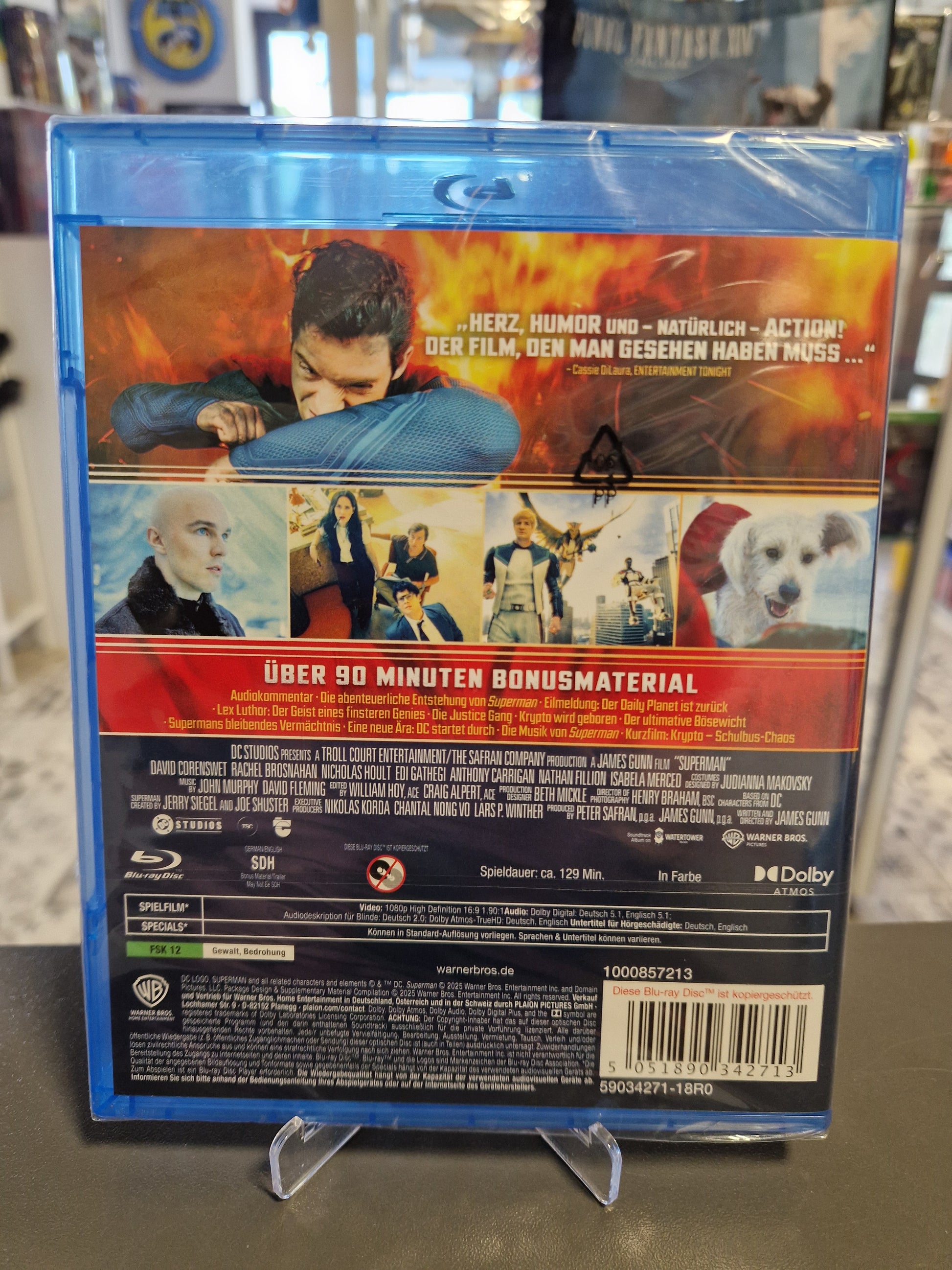 Rückseite der verschweißten Superman Blu-ray Hülle mit Filmszenen (unter anderem Lex Luthor und Krypto), Informationen zu den 90 Minuten Bonusmaterial, technischen Details und dem Barcode EAN 5051890342713.