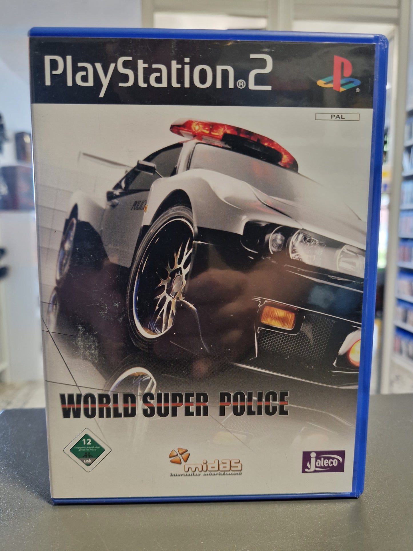 Vorderseite der PlayStation 2 Hülle von World Super Police mit USK 12 Logo.