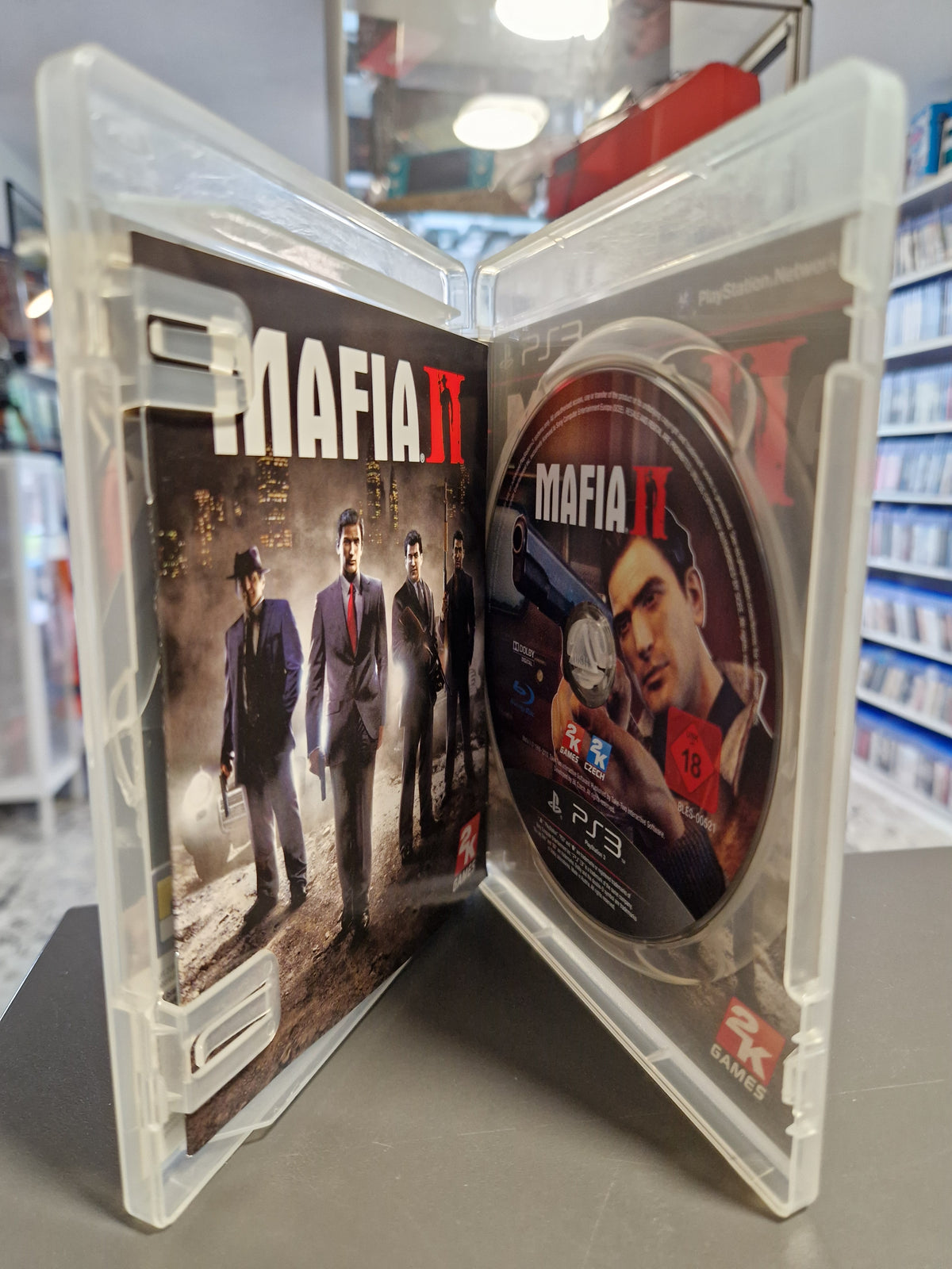Geöffnete PS3 Hülle von Mafia II mit Blu-ray Disc