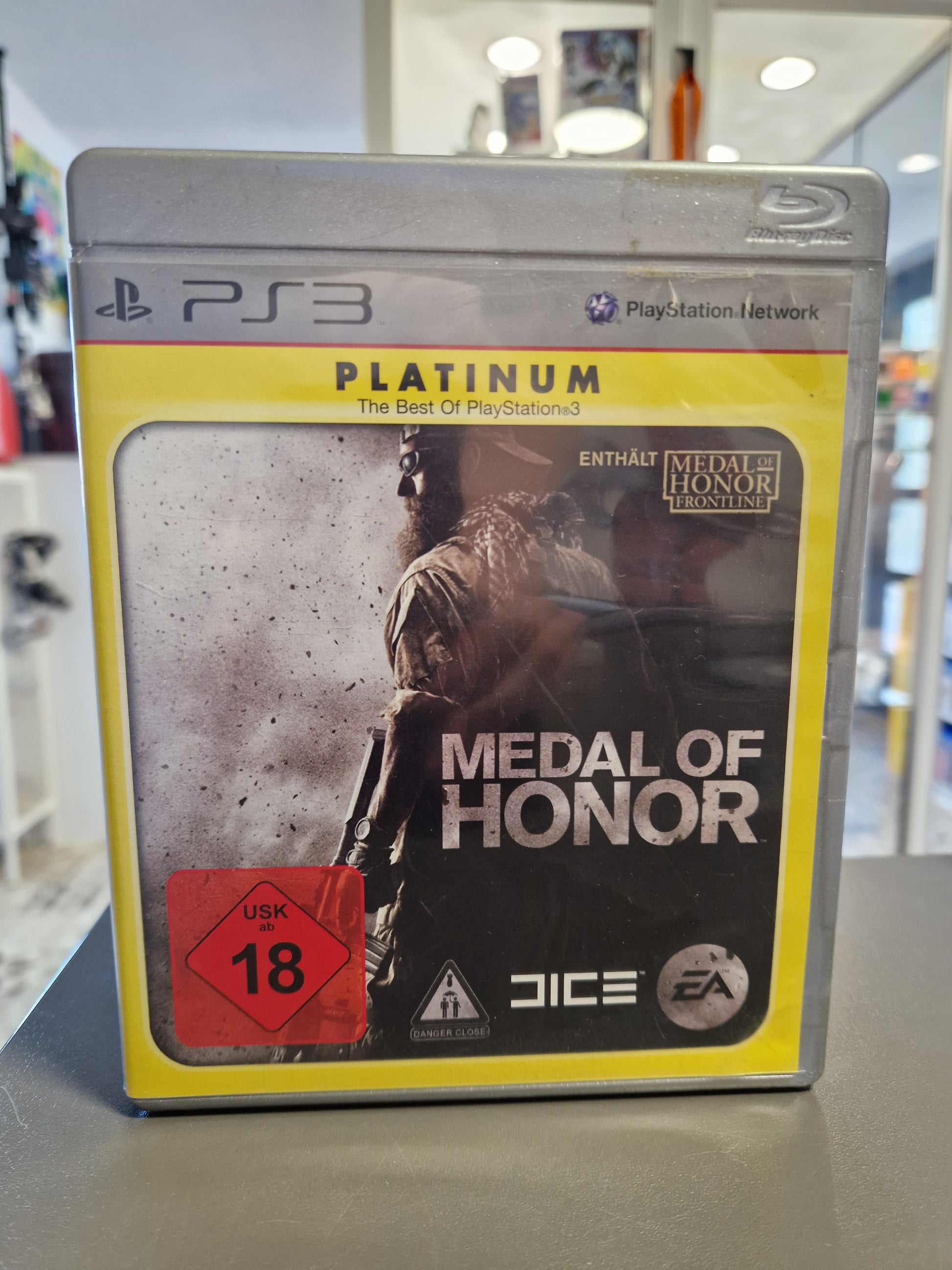 Medal of Honor PS3 Platinum Edition Hülle mit dem markanten silbernen Rand und dem bärtigen Tier-1-Soldaten.