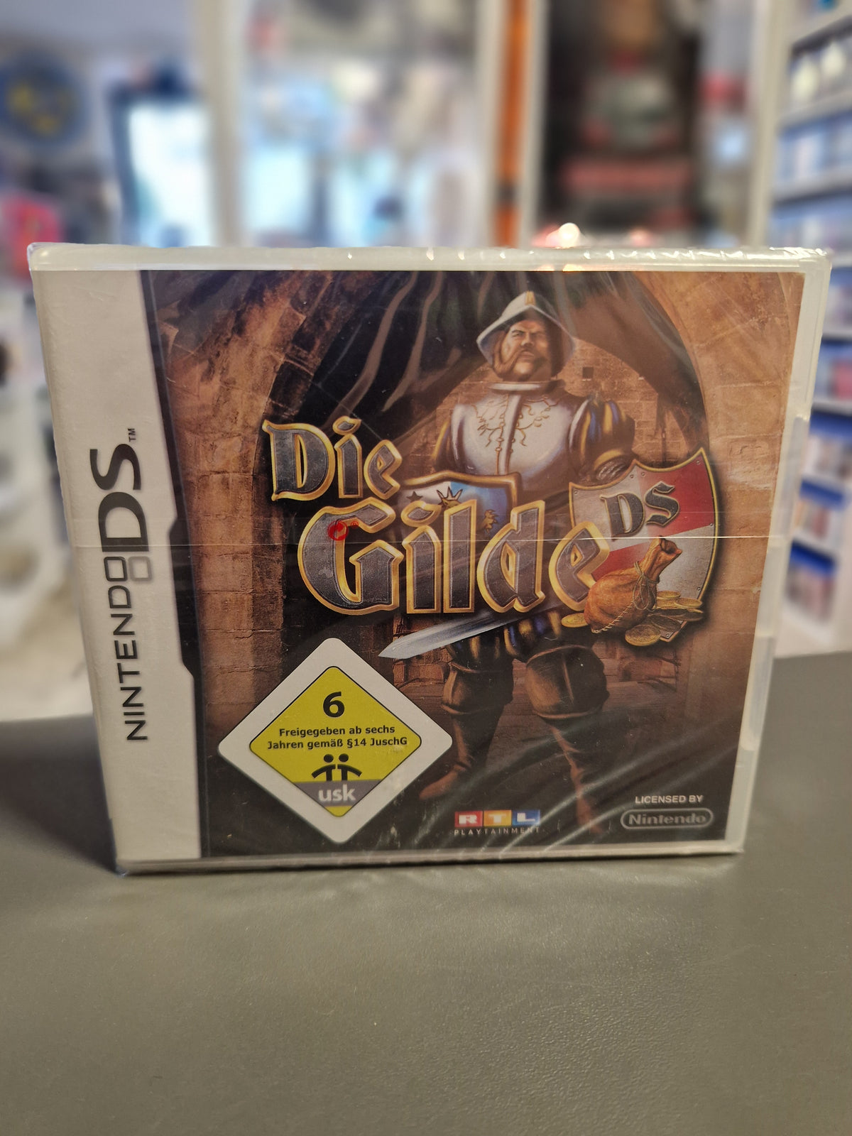 Vorderseite der originalversiegelten Nintendo DS Hülle von Die Gilde DS.
