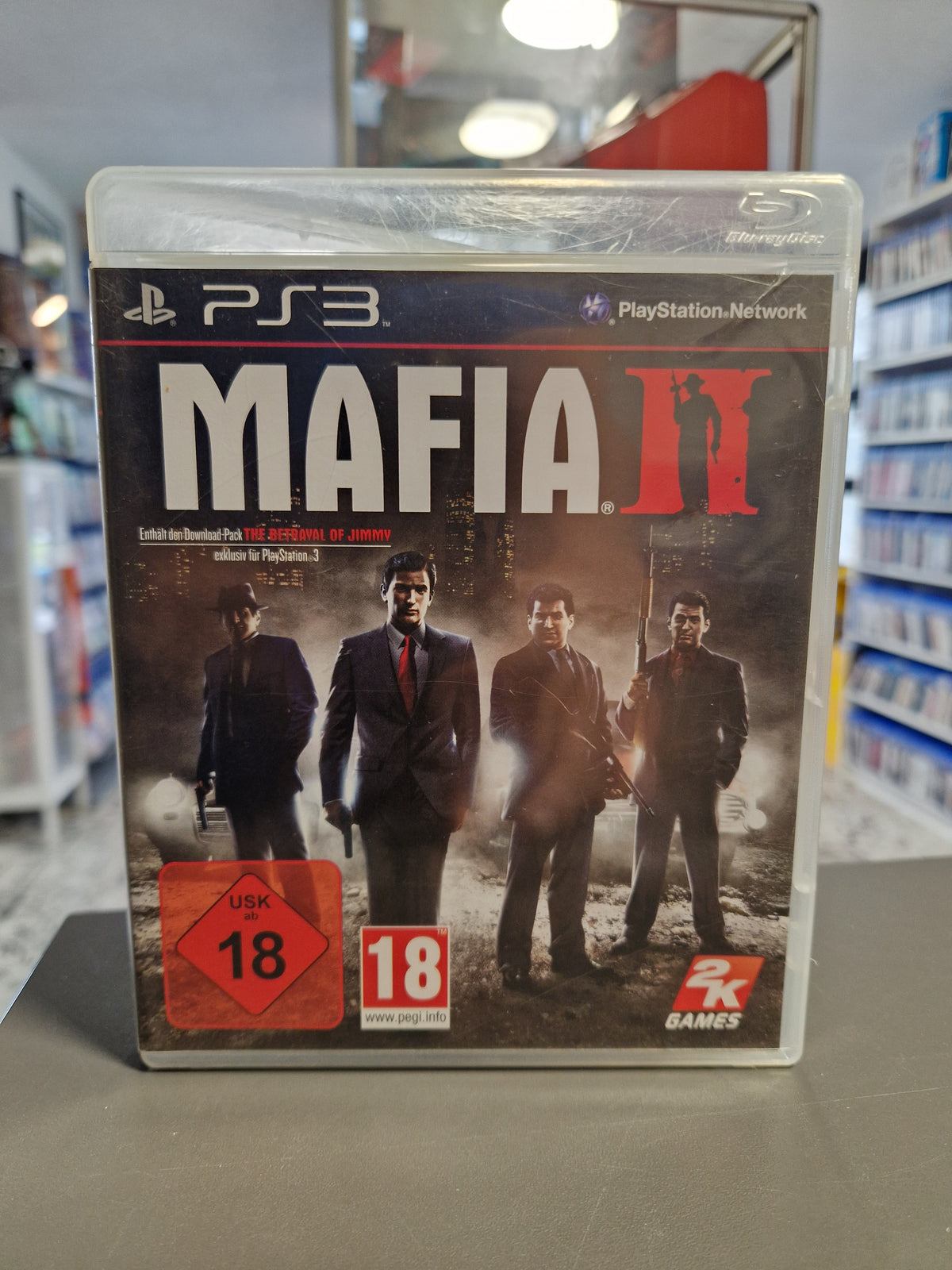 Vorderseite der PS3 Hülle von Mafia II mit Vito Scaletta und Charakteren