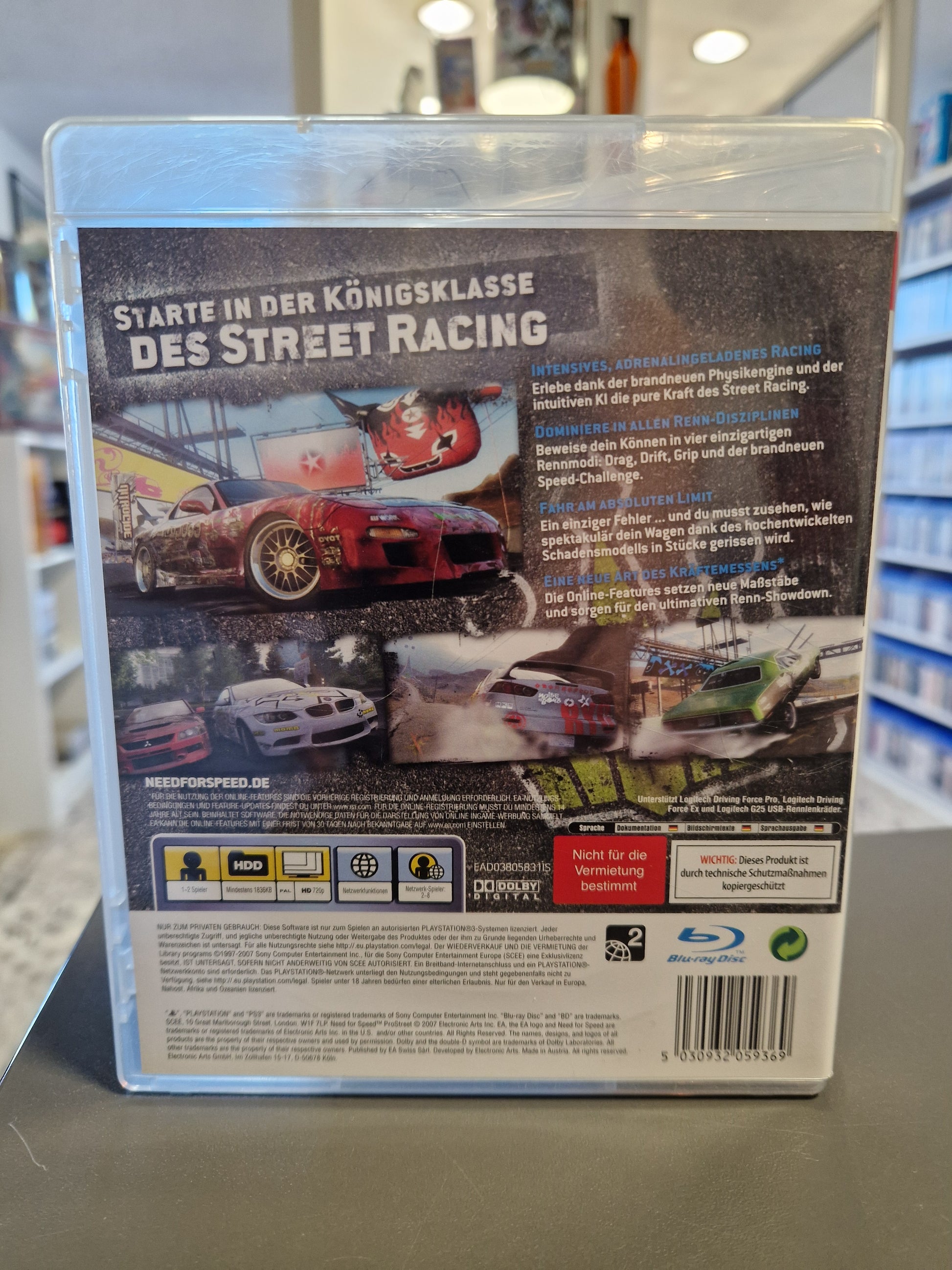 Rückseite der PS3 Verpackung mit Spielszenen, Tuning-Infos und dem Barcode 5030932059369.