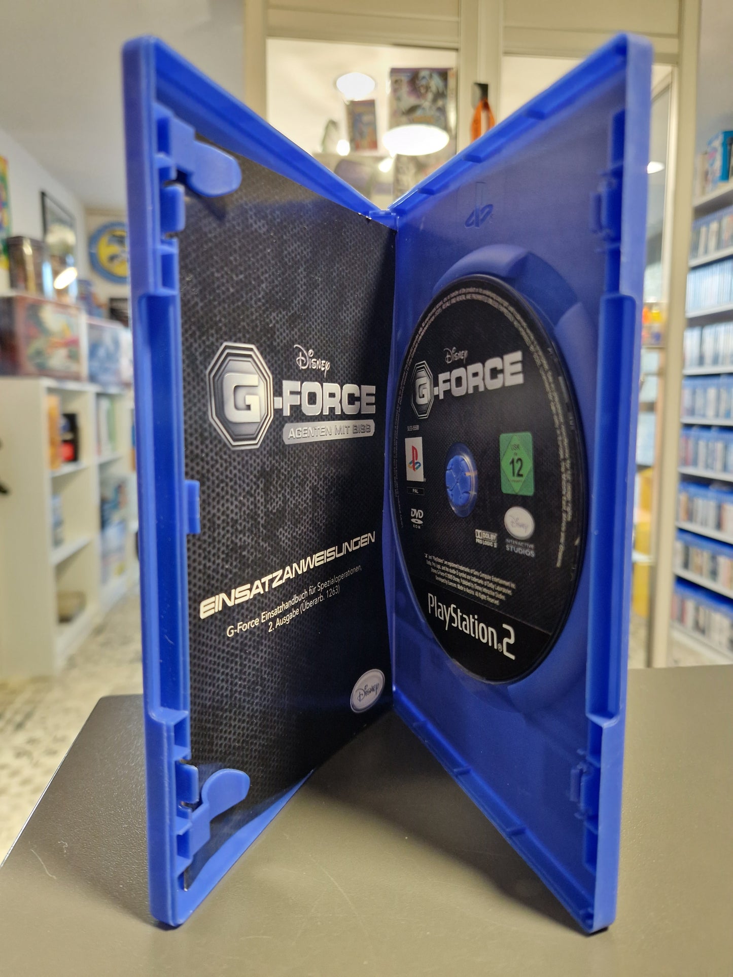 Geöffnete Hülle mit der Disc und der Anleitung.