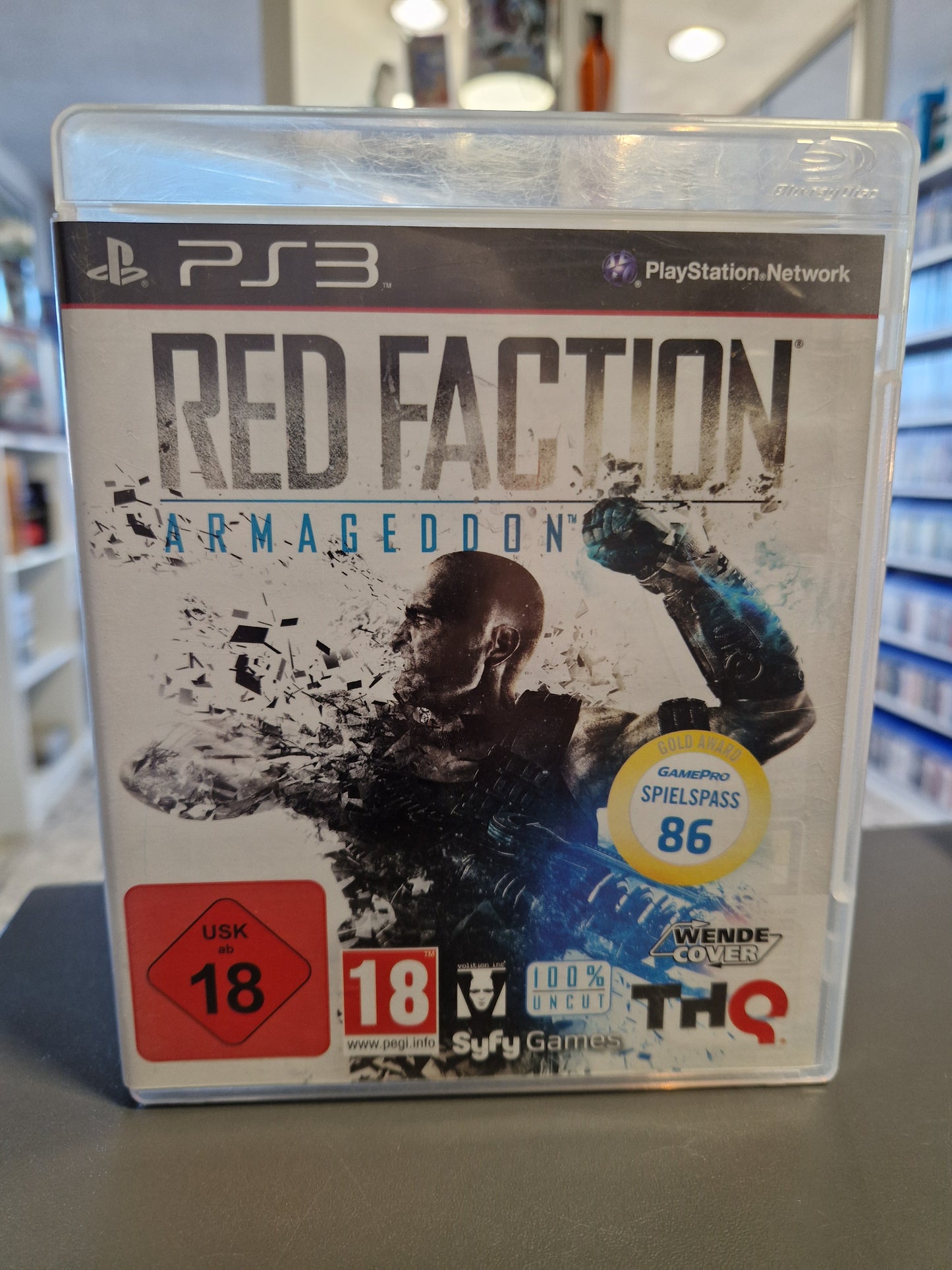 Red Faction Armageddon PS3 Cover mit Hauptcharakter Darius Mason und brennender Mars-Kulisse.