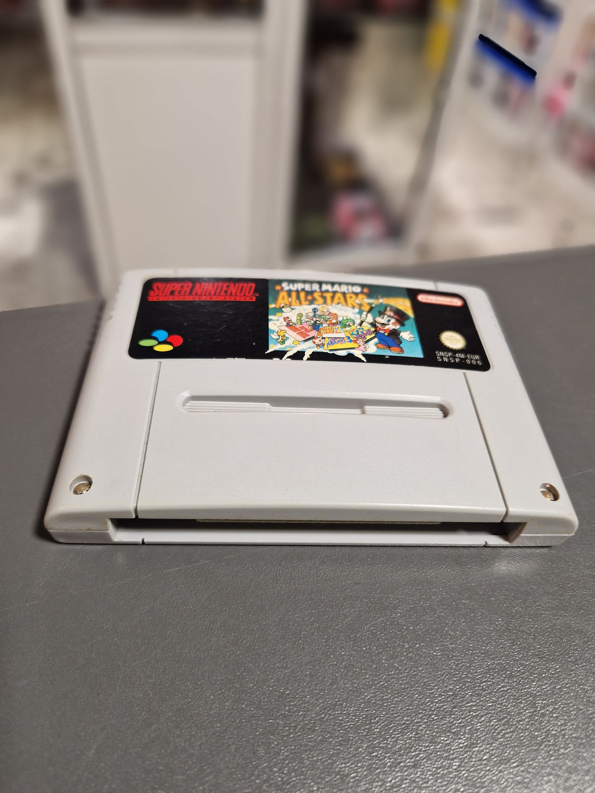 Draufsicht des Moduls Super Mario All Stars für Super Nintendo.