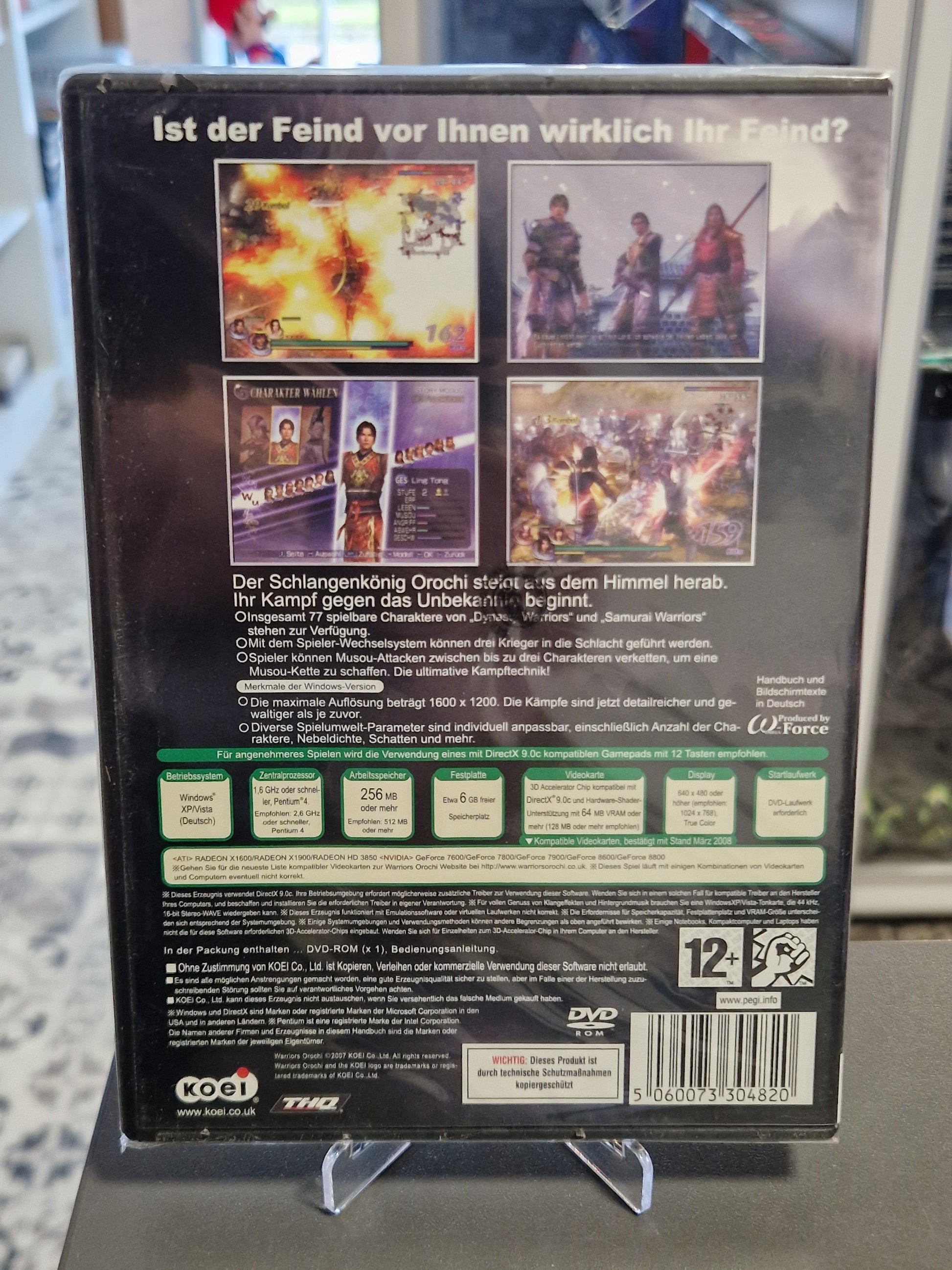 Rückseite der originalverpackten Hülle mit vier bunten In-Game-Screenshots, den Systemanforderungen und sichtbaren minimalen Rissen in der Außenfolie.