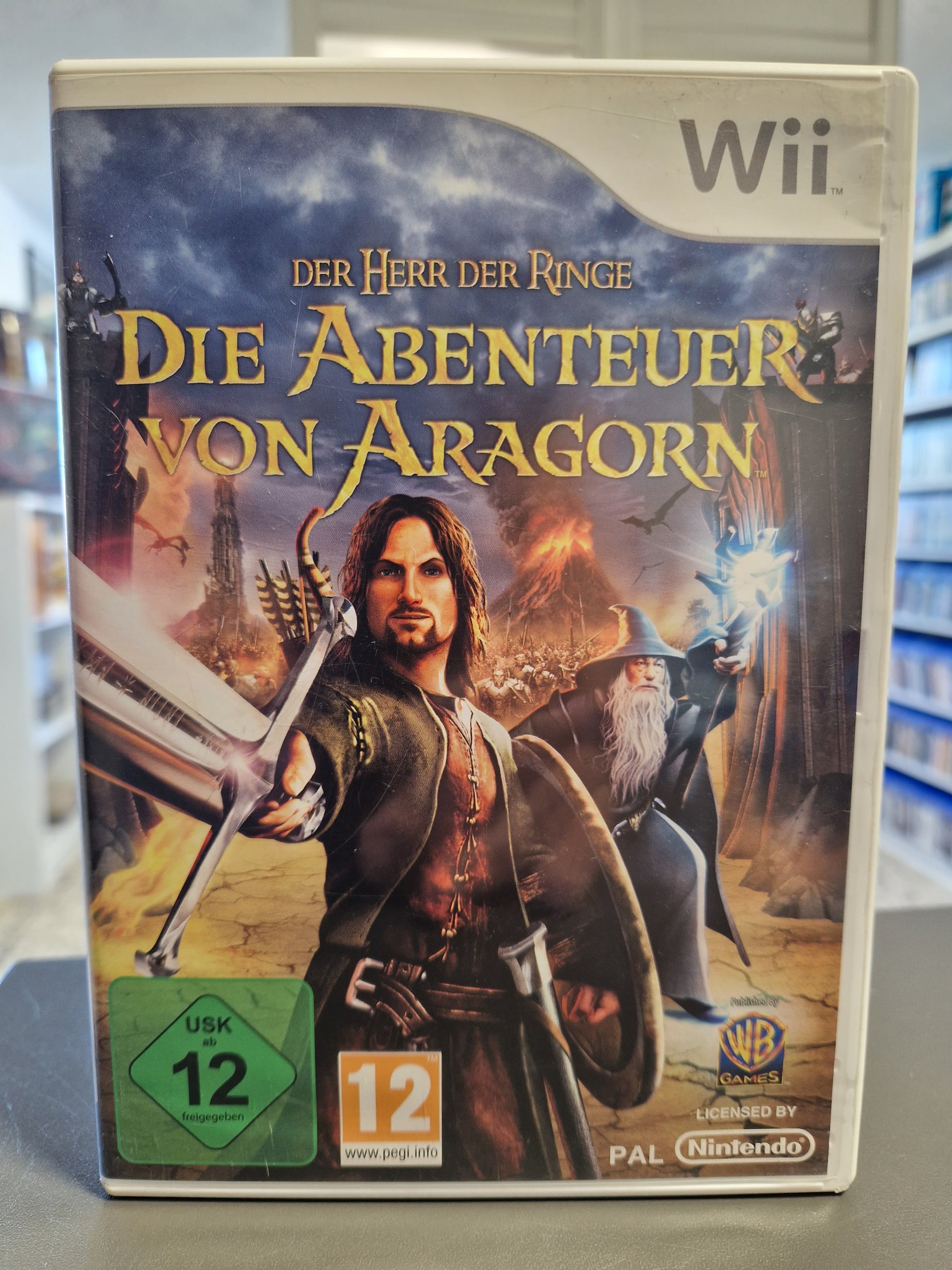 Vorderseite der Nintendo Wii Hülle von Der Herr der Ringe: Die Abenteuer von Aragorn mit USK 12 Logo.