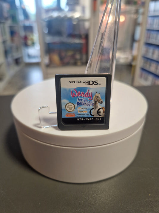 Nahaufnahme des Nintendo DS Moduls „Wendy: Ferien auf Rosenborg“ mit dem Wendy-Logo und Pferdemotiv.