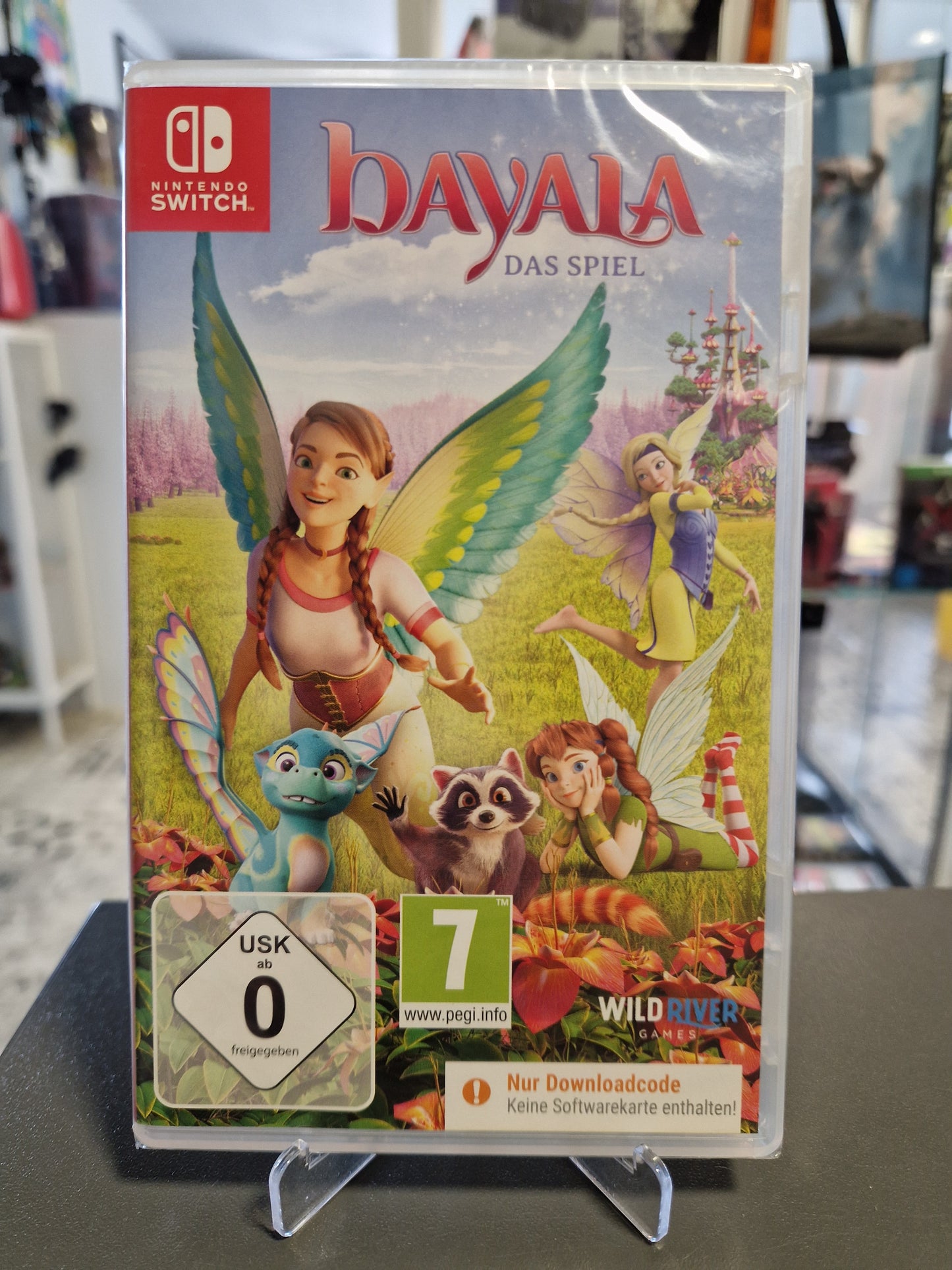 Vorderseite der originalverpackten Hülle von Bayala Das Spiel für Nintendo Switch mit Elfen-Charakteren, kleinen Drachen, dem USK 0 Logo und dem orangen Warnhinweis Nur Downloadcode.
