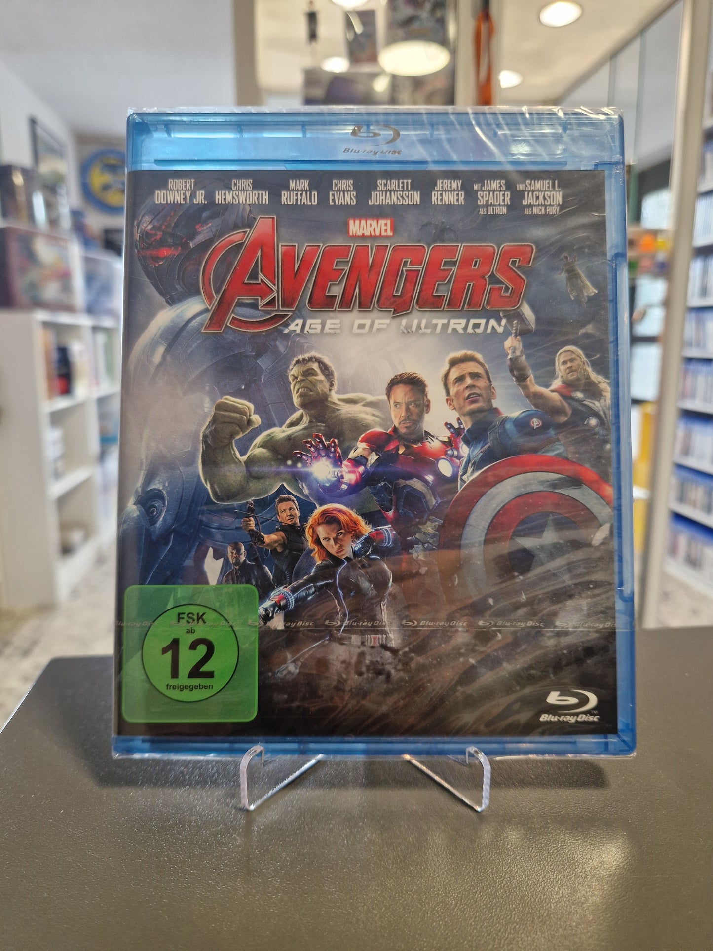 Blu-ray-Cover von „Marvel's Avengers: Age of Ultron“ in originaler Schutzfolie zeigt das Avengers-Team um Iron Man, Captain America, Thor und den Hulk im Kampf gegen Ultrons Roboter-Armee.