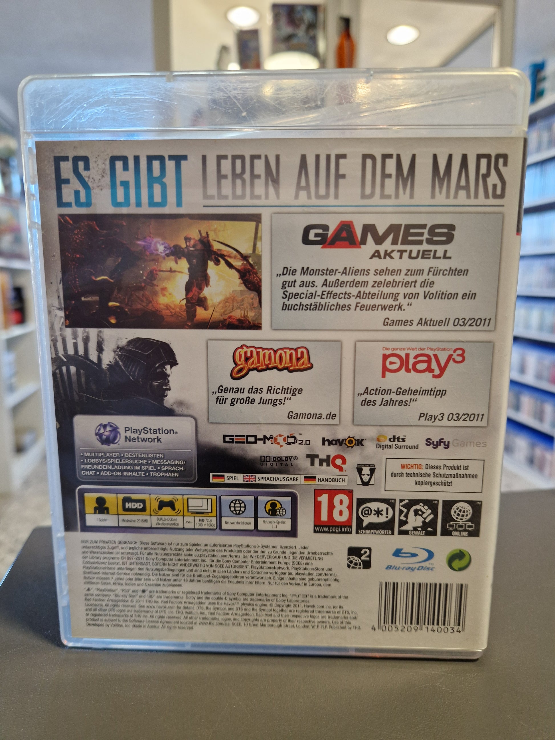 Rückseite der PS3 Verpackung mit Screenshots der zerstörbaren Umgebungen und Spielbeschreibungen.