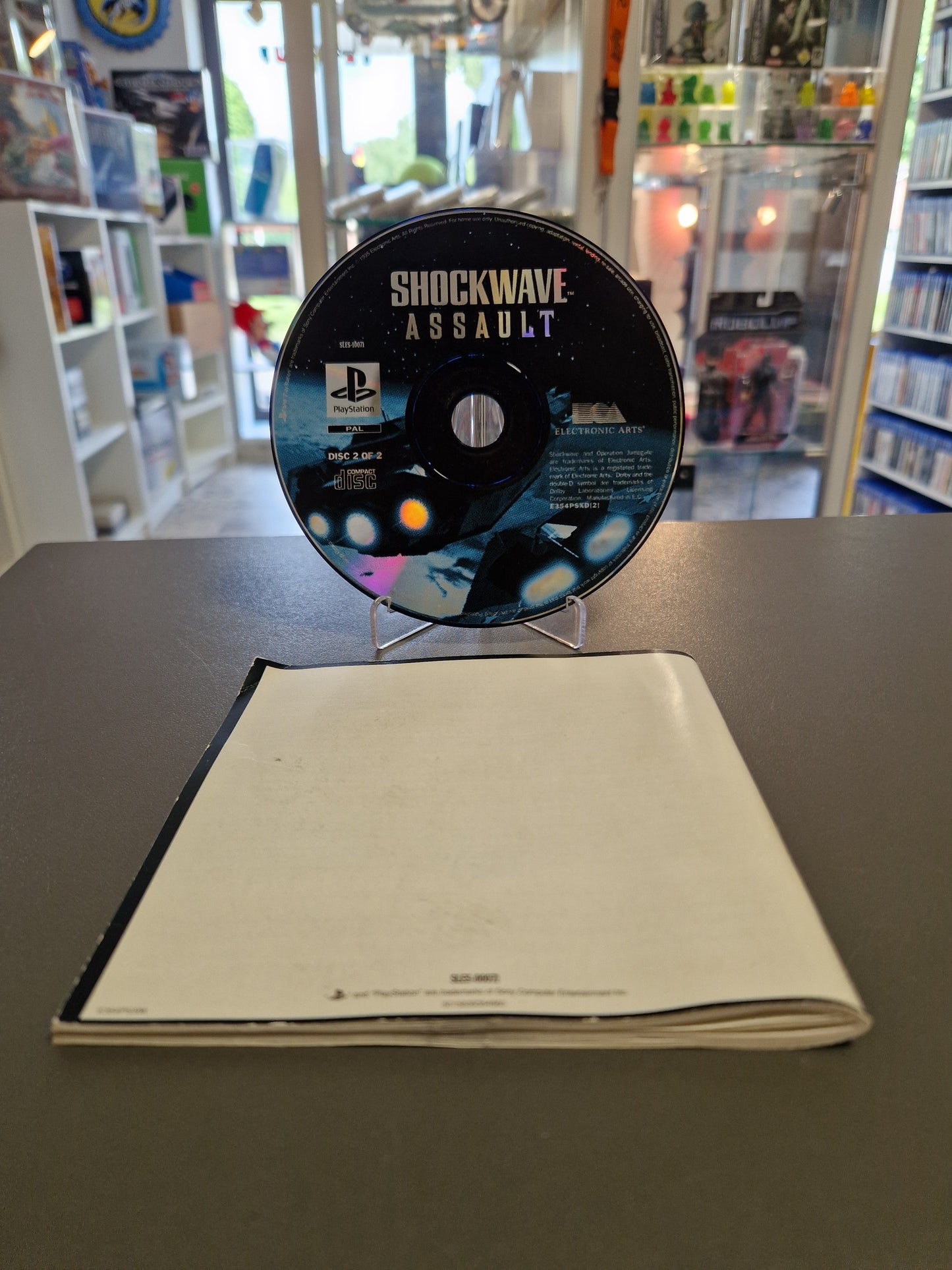 Ansicht der Rückseite der Shockwave Assault PS1 Spielanleitung
