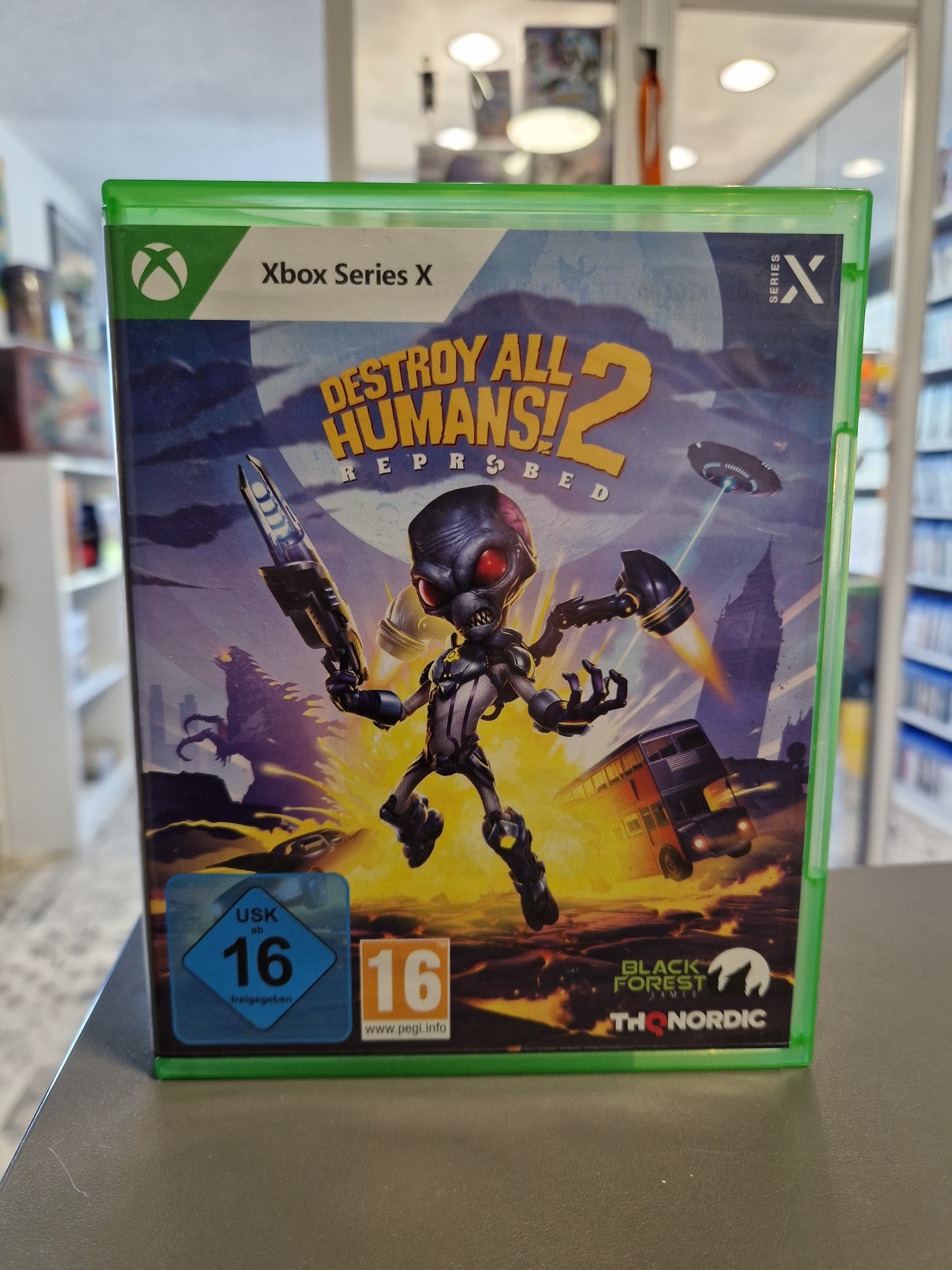 Xbox Series X Spielhülle von Destroy All Humans! 2 Reprobed in hervorragendem Zustand mit USK 16 Logo.