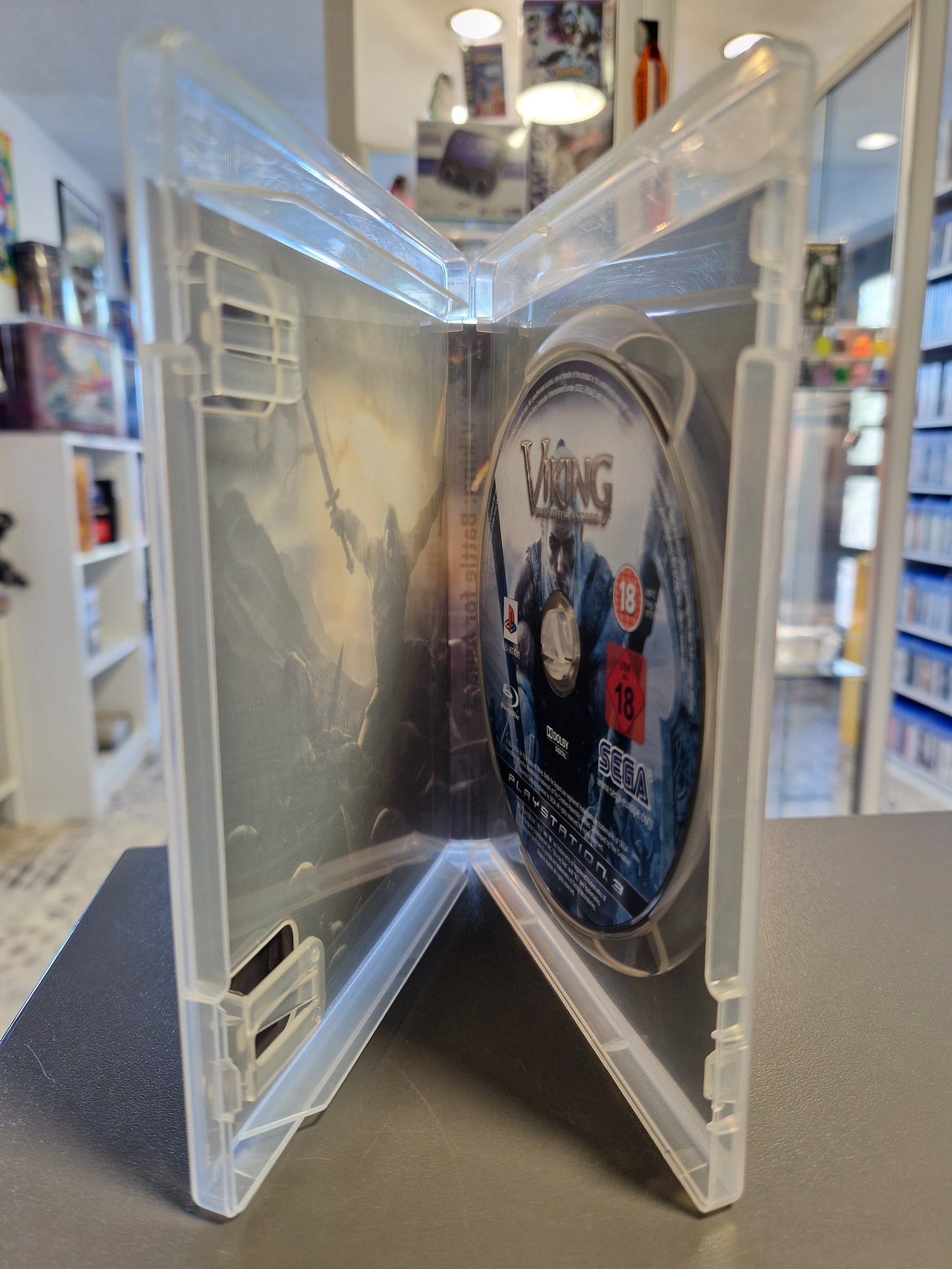 Geöffnete PS3-Hülle mit der glänzenden, kratzerfreien Disc.